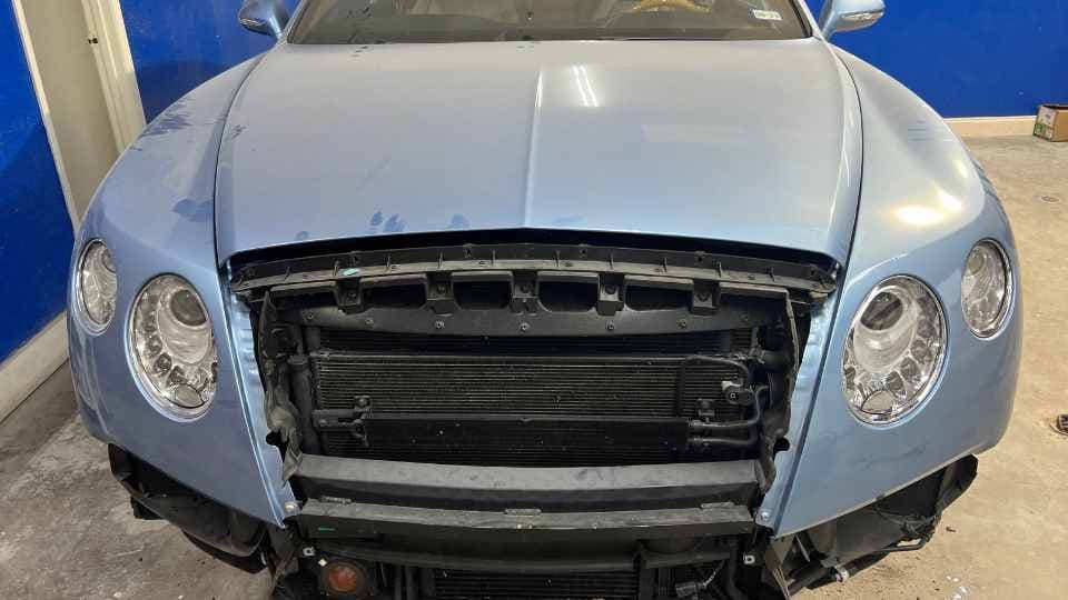 After repair: Reshaped front fender and flawless paint correction finish in Garland