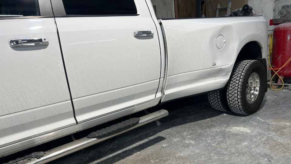 After repair: Smooth truck bed and tailgate with fresh, durable paint application