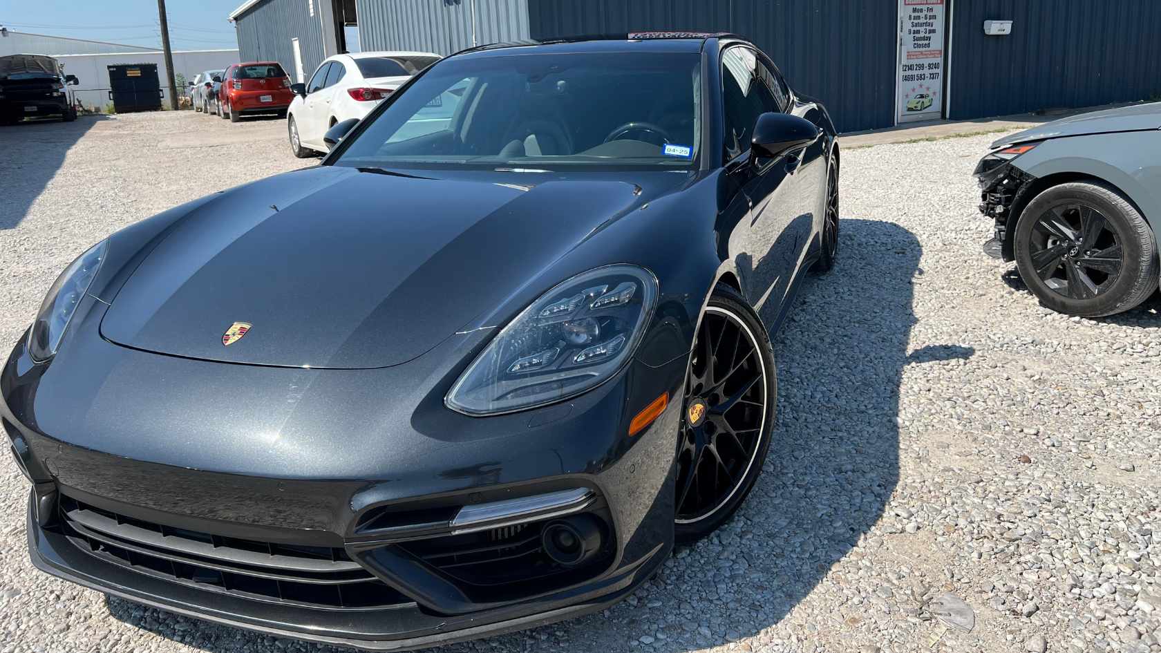 Modern sports car undergoing professional paint correction and polishing in Dallas area.