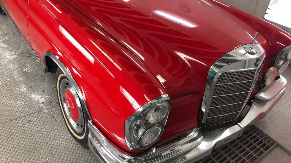 After repair: Completely restored classic car with factory-quality bodywork and fresh paint